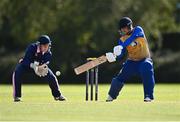 13 September 2020; Benjamin Marris of Cork County plays a shot watched by JJ Cassidy of YMCA during the All-Ireland T20 Semi-Final match between YMCA and Cork County at Pembroke Cricket Club in Dublin. Photo by Sam Barnes/Sportsfile