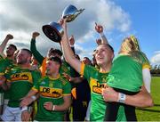 13 September 2020; Dunloy captain Paul Shields, carrying his daughter Ada, and his team-mates celebrate with the cup after the Antrim County Senior Hurling Championship Final match between Dunloy Cuchullains and Loughgiel Shamrocks at Páirc Mhic Uilín in Ballycastle, Antrim. Photo by Brendan Moran/Sportsfile