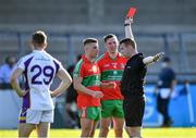 13 September 2020; Leon Young of Ballymun Kickhams, 7,  is shown the red card by referee James King late in the second half as team-mate Philly McMahon looks on during the Dublin County Senior Football Championship Semi-Final match between Ballymun Kickhams and Kilmacud Crokes at Parnell Park in Dublin. Photo by Piaras Ó Mídheach/Sportsfile