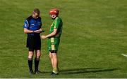 13 September 2020; The O'Callaghan's Mills captain Bryan Donnellan is booked by referee Wayne King during the Clare County Senior Hurling Championship Semi-Final match between Ballyea and O'Callaghan's Mills at Cusack Park in Ennis, Clare. Photo by Ray McManus/Sportsfile