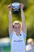 19 September 2020; UCD captain Ellen Curran lifts the trophy following her side's victory during the Women's Hockey Irish Senior Cup Final match between Pegasus and UCD at Lisnagarvey Hockey Club in Lisburn, Down. Photo by Seb Daly/Sportsfile