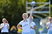 19 September 2020; UCD captain Ellen Curran lifts the trophy following her side's victory during the Women's Hockey Irish Senior Cup Final match between Pegasus and UCD at Lisnagarvey Hockey Club in Lisburn, Down. Photo by Seb Daly/Sportsfile