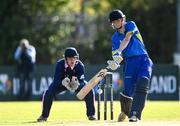 19 September 2020; Dwayne McGerrigle of Donemana plays a shot watched by JJ Cassidy of YMCA during the All-Ireland T20 Cup Final match between YMCA and Donemana at CIYMS Cricket Club in Belfast. Photo by Sam Barnes/Sportsfile