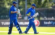 19 September 2020; Gary McClintock of Donemana, right, leaves the field after being dismissed, watched by his brother William McClintock during the All-Ireland T20 Cup Final match between YMCA and Donemana at CIYMS Cricket Club in Belfast. Photo by Sam Barnes/Sportsfile