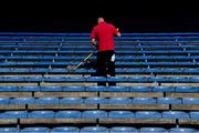 20 September 2020; Slawomir, an employee of Ryan's Cleaning, cleans the seats before the Tipperary County Senior Hurling Championship Final match between Kiladangan and Loughmore-Castleiney at Semple Stadium in Thurles, Tipperary. Photo by Ray McManus/Sportsfile