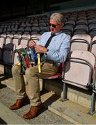 20 September 2020; Tim Floyd, Tipperary County Board Secretary, ties the ribbons of the teams to the Dan Breen Cup before the Tipperary County Senior Hurling Championship Final match between Kiladangan and Loughmore-Castleiney at Semple Stadium in Thurles, Tipperary. Photo by Ray McManus/Sportsfile