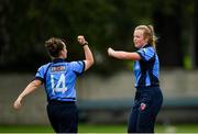 20 September 2020; Zara Craig of Typhoons, right, is congratulated by team-mate Laura Delany after bowling Kate McEvoy of Scorchers during the Women's Super Series match between Typhoons and Scorchers at Merrion Cricket Club in Dublin. Photo by Seb Daly/Sportsfile