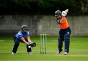 20 September 2020; Maria Kerrison of Scorchers plays a shot, watched by Thpoons wicket-keeper Sarah Forbes, during the Women's Super Series match between Typhoons and Scorchers at Merrion Cricket Club in Dublin. Photo by Seb Daly/Sportsfile