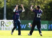 20 September 2020; Ted Britton, left, and Jacob Mulder of CIYMS celebrate after combining to take the wicket of Simi Singh of YMCA during the All-Ireland T20 European Cricket League Play-Off match between CIYMS and YMCA at CIYMS Cricket Club in Belfast. Photo by Sam Barnes/Sportsfile