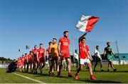 20 September 2020; Tinahely mascot Jack Murphy, age 9, leads the Tinahely team in the pre-match parade before the Wicklow County Senior Football Championship Final match between Tinahely and Baltinglass at Joule Park in Aughrim, Wicklow. Photo by Matt Browne/Sportsfile
