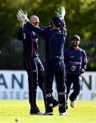 20 September 2020; James Cameron-Dow of CIYM, centre, is congratulated by team-mate and wicket keeper Chris Dougherty after completing a hat-trick in the games final over during the All-Ireland T20 European Cricket League Play-Off match between CIYMS and YMCA at CIYMS Cricket Club in Belfast. Photo by Sam Barnes/Sportsfile