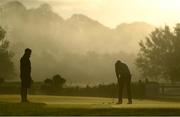 23 September 2020; Jason Scrivener of Australia practices on the putting green, watched by his caddie Charlie George, ahead of a practice round ahead of the Dubai Duty Free Irish Open Golf Championship at Galgorm Spa & Golf Resort in Ballymena, Antrim. Photo by Brendan Moran/Sportsfile