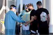 23 September 2020; Daniel Kelly receives hand sanitiser upon entering the stadium before a Dundalk training session at Stadionul Sheriff in Tiraspol, Moldova. Photo by Alex Nicodim/Sportsfile