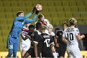 24 September 2020; Zvonimir Mikulic of FC Sheriff Tiraspol saves from Sean Hoare of Dundalk during the UEFA Europa League Third Qualifying Round match between FC Sheriff Tiraspol and Dundalk at the Stadionul Sheriff in Tiraspol, Moldova. Photo by Alex Nicodim/Sportsfile