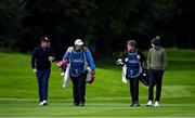 25 September 2020; Scott Hend of Australia, left, and Tom McKibben of Northern Ireland and their caddies Tony Carolan and Ryan McGuigan walk without their playing partner Sebastian Soderberg of Sweden, after The European Tour withdrew Soderberg from this week’s event after the Swede was notified of a contact who has subsequently tested positive for COVID-19, during day two of the Dubai Duty Free Irish Open Golf Championship at Galgorm Spa & Golf Resort in Ballymena, Antrim. Photo by Brendan Moran/Sportsfile