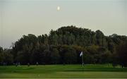 25 September 2020; Shane Lowry of Ireland watches his second shot to the 16th hole as a moon rises during day two of the Dubai Duty Free Irish Open Golf Championship at Galgorm Spa & Golf Resort in Ballymena, Antrim. Photo by Brendan Moran/Sportsfile