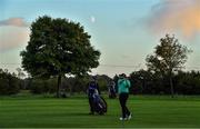 25 September 2020; Shane Lowry of Ireland watches his second shot to the 15th hole as a moon rises during day two of the Dubai Duty Free Irish Open Golf Championship at Galgorm Spa & Golf Resort in Ballymena, Antrim. Photo by Brendan Moran/Sportsfile
