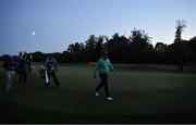 25 September 2020; Shane Lowry of Ireland and George Coetzee of South Africa, left, leave the 18th green under a rising moon and fading light at the end of their second round during day two of the Dubai Duty Free Irish Open Golf Championship at Galgorm Spa & Golf Resort in Ballymena, Antrim. Photo by Brendan Moran/Sportsfile