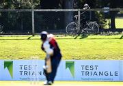 26 September 2020; A Cyclist in the parks stops to watch during the Test Triangle Inter-Provincial Series 50 over match between Leinster Lightning and Northern Knights at Malahide Cricket Club in Dublin. Photo by Sam Barnes/Sportsfile