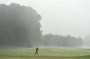 27 September 2020; A member of the greenkeeping staff prepares the 18th fairway as play was suspended due to adverse weather during day four of the Dubai Duty Free Irish Open Golf Championship at Galgorm Spa & Golf Resort in Ballymena, Antrim. Photo by Brendan Moran/Sportsfile