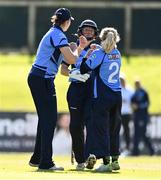 27 September 2020; Sarah Forbes of Typhoons, centre, celebrates with team-mates, Rebecca Stokell, left, and Celeste Raack after catching out Shauna Kavanagh of Scorchers during the Women's Super Series match between Scorchers and Typhoons at Malahide Cricket Club in Dublin. Photo by Sam Barnes/Sportsfile