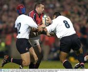 17 January 2004; Rob Henderson, Munster, is tackled by Henry Paul and Junior Paramore, 8, Gloucester. Heineken European Cup 2003-2004, Round 4, Pool 5, Munster v Gloucester, Thomond Park, Limerick. Picture credit; Matt Browne / SPORTSFILE *EDI*