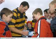 18 January 2004; Felipe Contepomi, Co. Carlow, autographs the jersey of 9 year old Carlow fan Jonathan Abbott. AIB All Ireland League 2003-2004, Division 1, Shannon v Co. Carlow, Thomond Park, Limerick. Picture credit; Matt Browne / SPORTSFILE *EDI*