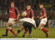 17 January 2004; Rob Henderson, Munster, supported by team-mates Anthony Foley, left, and Ronan O'Gara, in action against Alex Brown, Gloucester. Heineken European Cup 2003-2004, Round 4, Pool 5, Munster v Gloucester, Thomond Park, Limerick. Picture credit; Brendan Moran / SPORTSFILE *EDI*