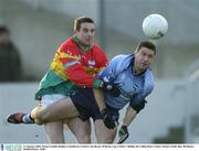 11 January 2004; Senan Connell, Dublin, is tackled by Carlow's Joe Byrne. O'Byrne Cup, Carlow v Dublin, Dr Cullen Park, Carlow. Picture credit; Ray McManus / SPORTSFILE *EDI*