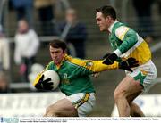 18 January 2004; Evan Kelly, Meath, in action against Kieran Kiely, Offaly. O'Byrne Cup Semi-Final, Meath v Offaly, Pairc Tailteann, Navan, Co. Meath. Picture credit; Brian Lawless / SPORTSFILE *EDI*