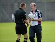 29 June 2013; Westmeath manager Pat Flanagan hands a football to referee Rory Hickey before the match. GAA Football All-Ireland Senior Championship, Round 1, Westmeath v Fermanagh, Cusack Park, Mullingar, Co. Westmeath. Picture credit: Brian Lawless / SPORTSFILE
