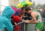 22 June 2013; Shane Quinn, Ireland, signs autographs for supporters after competing in the European Athletics Team Championships 1st League. Morton Stadium, Santry, Co. Dublin. Picture credit: Brendan Moran / SPORTSFILE