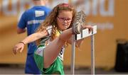 2 July 2013; Grainne McMahon, age 7, from Shannon AC, stretches using a hurdle before competing in the U9's Girl's 300m race at the 62nd Cork City Sports. Cork Institute of Technology, Bishopstown, Cork. Picture credit: Diarmuid Greene / SPORTSFILE
