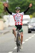 4 July 2013; Eddie Dunbar, Ireland - Stena Line, celebrates as he crosses the finish line to take victory on Stage 3 on the 2013 Junior Tour of Ireland, Ennis - Ennis, Co. Clare. Picture credit: Stephen McMahon / SPORTSFILE