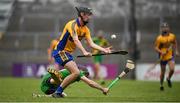 27 September 2020; Alan Mulready of Sixmilebridge in action against Patrick Donnellan of O'Callaghan's Mills during the Clare County Senior Hurling Championship Final match between O'Callaghan's Mills and Sixmilebridge at Cusack Park in Ennis, Clare. Photo by David Fitzgerald/Sportsfile