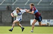 27 September 2020; Conor O'Donoghue of St Loman's Mullingar is tackled by Aaron O'Brien of Tyrrelspass during the Westmeath County Senior Football Championship Final match between Tyrrelspass and St Loman's Mullingar at TEG Cusack Park in Mullingar, Westmeath. Photo by Ramsey Cardy/Sportsfile