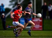 27 September 2020; John Clutterbuck of Naomh Mairtin in action against Éimhín Keenan of Ardee St Mary's during the Louth County Senior Football Championship Final match between Naomh Mairtin and Ardee St Mary’s at Darver Louth Centre of Excellence in Louth. Photo by Ben McShane/Sportsfile