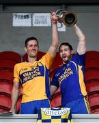 27 September 2020; Sixmilebridge joint-captains Shane Golden, left, and Derek Fahy lift the cup following the Clare County Senior Hurling Championship Final match between O'Callaghan's Mills and Sixmilebridge at Cusack Park in Ennis, Clare. Photo by David Fitzgerald/Sportsfile