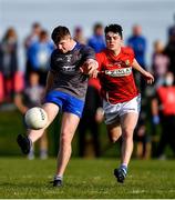 27 September 2020; Mark Whelan of Naomh Mairtin kicks a point despite the attention of Tom Jackson of Ardee St Mary's during the Louth County Senior Football Championship Final match between Naomh Mairtin and Ardee St Mary’s at Darver Louth Centre of Excellence in Louth. Photo by Ben McShane/Sportsfile