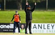 27 September 2020; Umpire Paul Reynolds signals a six during the Women's Super Series match between Scorchers and Typhoons at Malahide Cricket Club in Dublin. Photo by Sam Barnes/Sportsfile