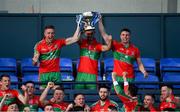 27 September 2020; Ballymun Kickhams captain James McCarthy, centre, lifts the Clerys Perpetual Cup alongside Paddy Small, left, and John Small after the Dublin County Senior 1 Football Championship Final match between Ballyboden St Enda's and Ballymun Kickhams at Parnell Park in Dublin. Photo by Piaras Ó Mídheach/Sportsfile