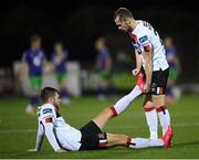 27 September 2020; Will Patching has his leg stretched by his Dundalk team-mate Cameron Dummigan during the SSE Airtricity League Premier Division match between Dundalk and Shamrock Rovers at Oriel Park in Dundalk, Louth. Photo by Stephen McCarthy/Sportsfile