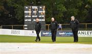 28 September 2020; Umpires Paul Reynolds, left, and Mark Hawthorne, centre, along with match referee Kevin Gallagher, walk the pitch as rain delays play during the Test Triangle Inter-Provincial Series 50 over match between Leinster Lightning and North-West Warriors at Malahide Cricket in Dublin. Photo by Sam Barnes/Sportsfile