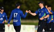 28 September 2020; Stuart Thompson of North West Warriors, left, celebrates with Craig Young after catching Stephen Doheny of Leinster Lightning during the Test Triangle Inter-Provincial Series 50 over match between Leinster Lightning and North-West Warriors at Malahide Cricket in Dublin. Photo by Sam Barnes/Sportsfile
