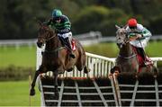 29 September 2020; Dewcup, left, with Mark Walsh up, jumps the last ahead of eventual second place Curlew Hill, with Jack Kennedy up, on their way to winning the Dooley Insurance Group Hurdle at Punchestown Racecourse in Kildare. Photo by Seb Daly/Sportsfile