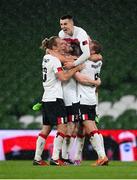 1 October 2020; Dundalk players, from left, Greg Sloggett, Sean Hoare, Darragh Leahy, top, Daniel Cleary, hidden, and John Mountney celebrate following the UEFA Europa League Play-off match between Dundalk and Ki Klaksvik at the Aviva Stadium in Dublin. Photo by Stephen McCarthy/Sportsfile