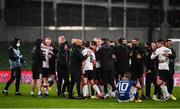 1 October 2020; Dundalk players and staff celebrate as Jóannes Bjartalíð, 10, of Ki Klaksvik looks on following the UEFA Europa League Play-off match between Dundalk and Ki Klaksvik at the Aviva Stadium in Dublin. Photo by Ben McShane/Sportsfile