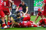 3 October 2020; Kevin O'Byrne of Munster celebrates with team-mates after scoring his side's third try during the Guinness PRO14 match between Scarlets and Munster at Parc y Scarlets in Llanelli, Wales. Photo by Darren Griffiths/Sportsfile