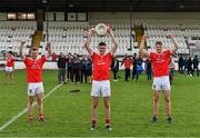 3 October 2020; Athy captain David Hyland, centre, and his team-mates Niall Kelly, left, and Kevin Feely celebrate with the Dermot Bourke cup after the Kildare County Senior Football Championship Final match between Moorefield and Athy at St Conleth's Park in Newbridge, Kildare. Photo by Piaras Ó Mídheach/Sportsfile