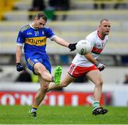 4 October 2020; Joseph Wallace of Ratoath kicks a point despite the attention of Paul Tormey of Gaeil Colmcille during the Meath County Senior Football Championship Final match between Ratoath and Gaeil Colmcille at Páirc Táilteann in Navan, Meath. Photo by Brendan Moran/Sportsfile